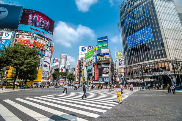 Shibuya Crossing Tokyo, Japan - July 30, 2019 : Scenery of Shibuya big scramble crossing area at the weekday morning in summer season. shibuya district stock pictures, royalty-free photos & images