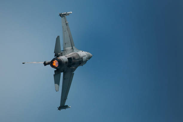 istock Jet fighter in the sky make a turn 1165077169