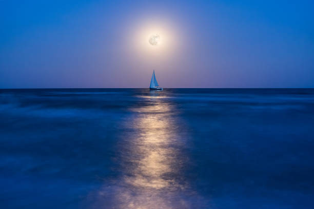 istock Night landscape with yacht on sea 1165077439