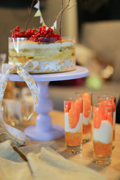 istock Delicious cake with red viburnum on and drinks 1165078687