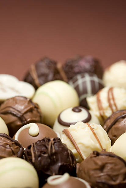 istock Truffles and chocolates with brown background 116507999