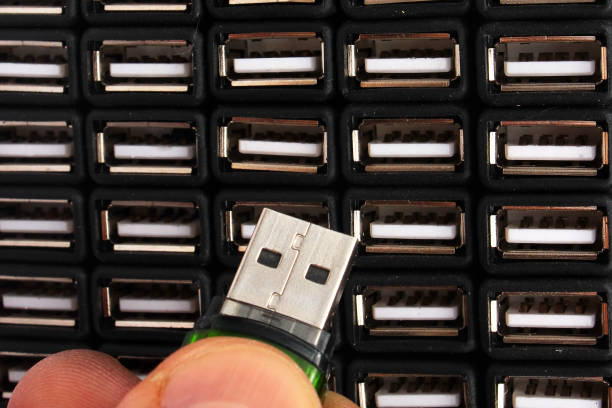 istock Inserting USB flash drive in one of many sockets 1165080493