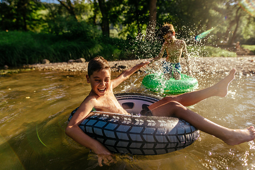 Boys spending summer day on the river