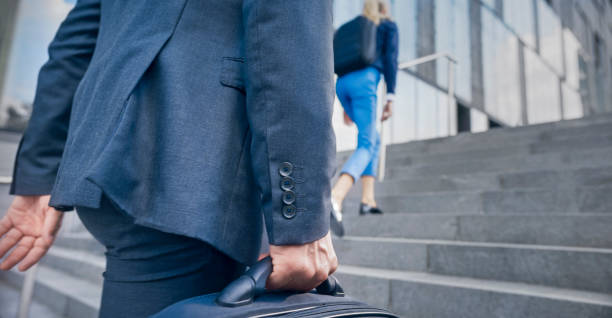 istock Businessman with laptop bag 1165082334