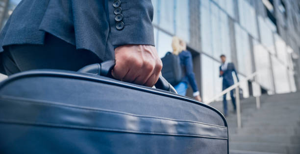 istock Businessman with laptop bag 1165082344