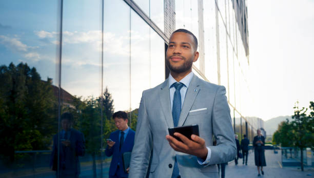 istock Businessman holding digital tablet 1165082358