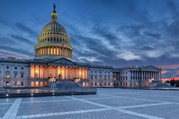 United States Capitol building at Twilight The United States Capitol building at sunset, Washington DC, USA. capitol hill stock pictures, royalty-free photos & images