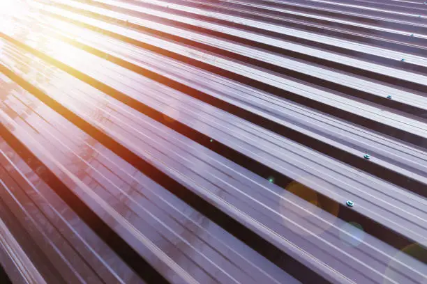 Photo of Corrugated metal roofing in brown paint color.