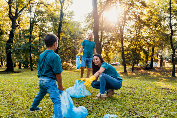 istock Group of volunteers cleaning public park 1165085699