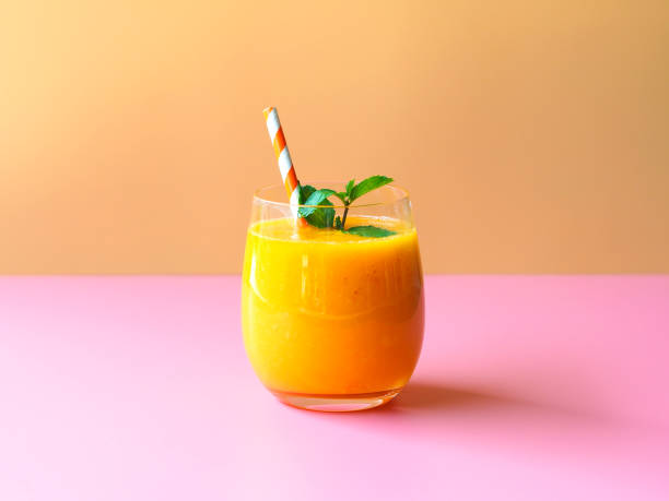 mango smoothies. - orange smoothie imagens e fotografias de stock