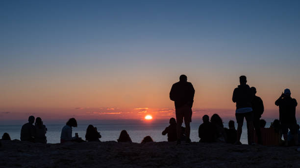 istock Rear view of people watching the Sunset 1165090008