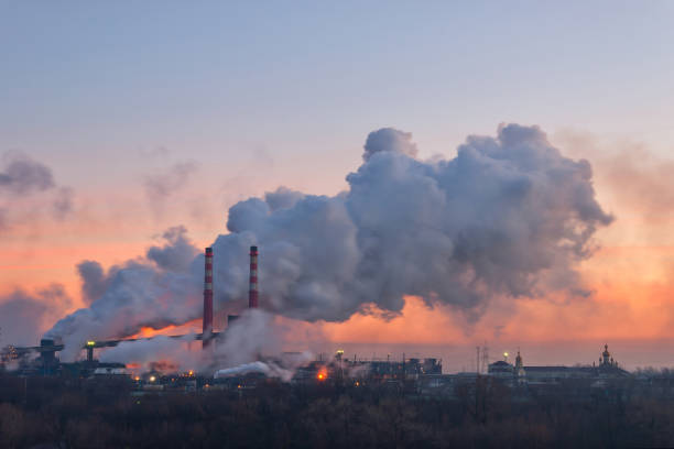 istock Pipes and polluting smoke 1165092306