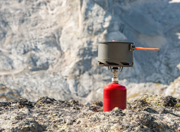 istock Tourist equipment and tools: camping gas on mountain background 1165094276