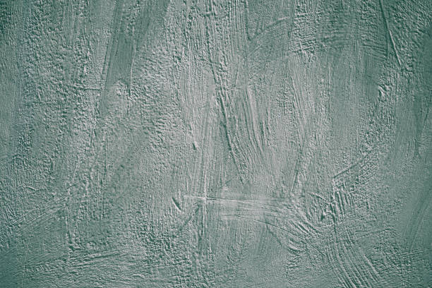 istock Gray and green grunge background. Painted concrete wall. Rough scabrous texture surface. Abstract pattern for decoration design. Old dark dirty wall, retro grey stone, cement. 1165096316