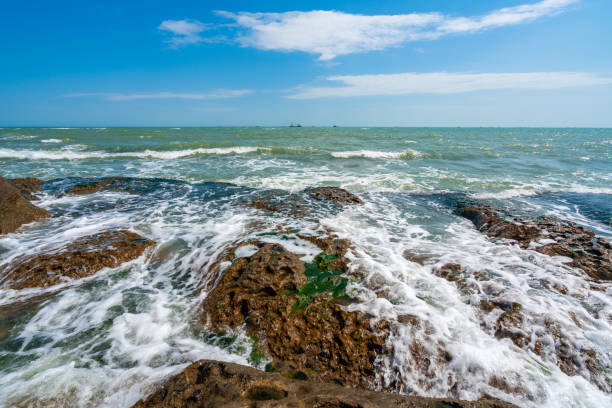Rocky seashore and storm waves