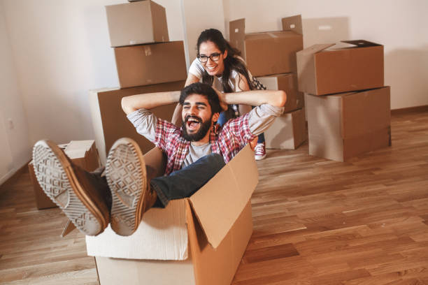 istock Young couple moving into a new home. 1165098441