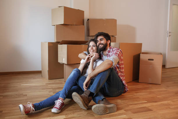 istock Young couple moving into a new home. 1165098469