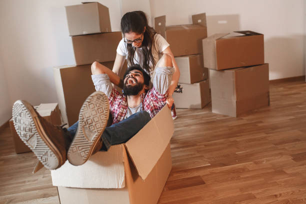 istock Young couple moving into a new home. 1165098530