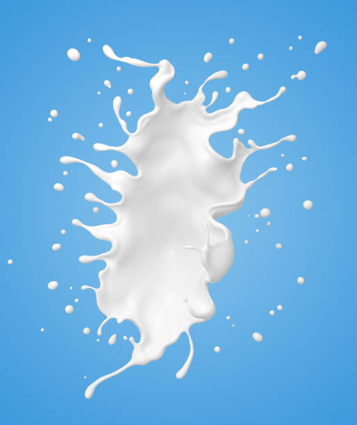 istock milk or yogurt splash isolated on blue background. 1165098644