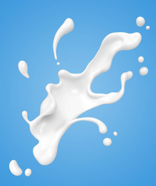 istock white milk or yogurt splash isolated on blue background. 1165098650