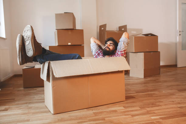 istock Young man moving into a new home. 1165099026