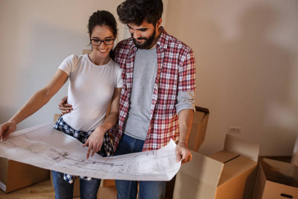istock Young couple moving into a new house. 1165099601