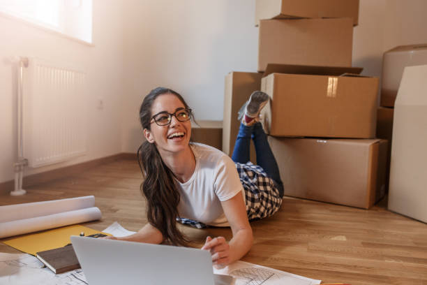 istock Young woman moving into a new house. 1165099721