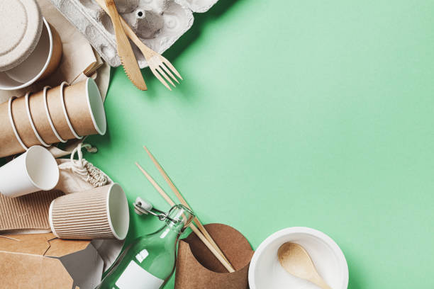 istock Zero waste, eco friendly, plastic free background. Cotton bag, glass jar and recycled tableware top view. 1165099745
