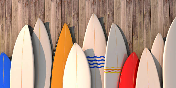 istock Many different colored surfboards standing in a row on a wooden wall -3d illustration 1165099850