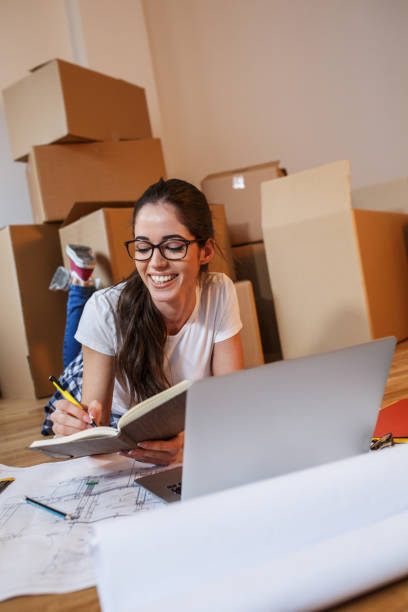 istock Young woman moving into a new house. 1165099898