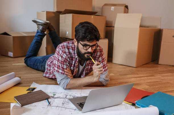 Young man moving into a new house.