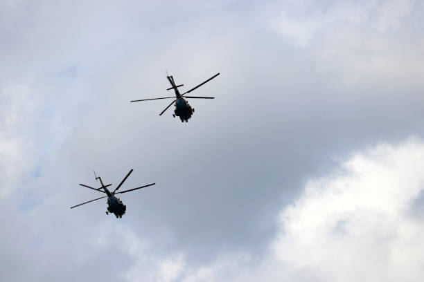 istock Two russian military helicopters in flight 1165101668