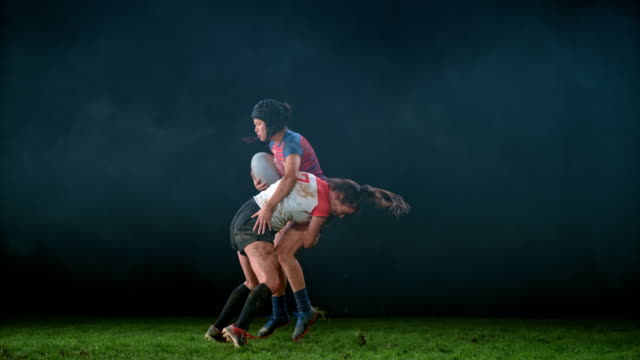 SLO MO LD SPEED RAMP Female rugby player tackling her opponent to the ground