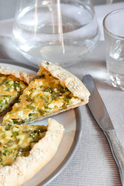 istock Tart with eggs and green onions on a plate 1165102911