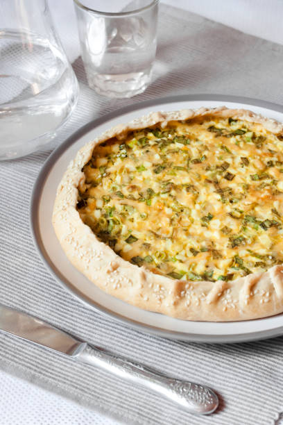 istock Tart with eggs and green onions on a plate 1165103068