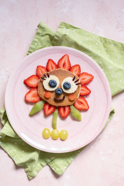 istock Funny Flower Pancake with berries for kids 1165103087