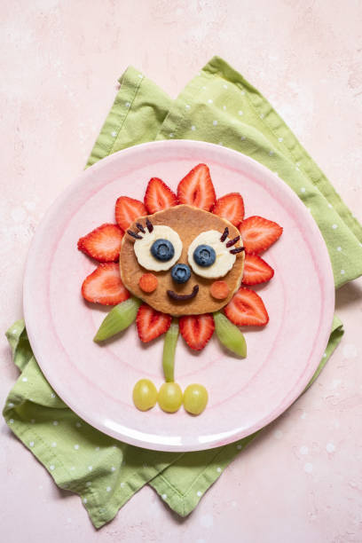istock Funny Flower Pancake with berries for kids 1165103099