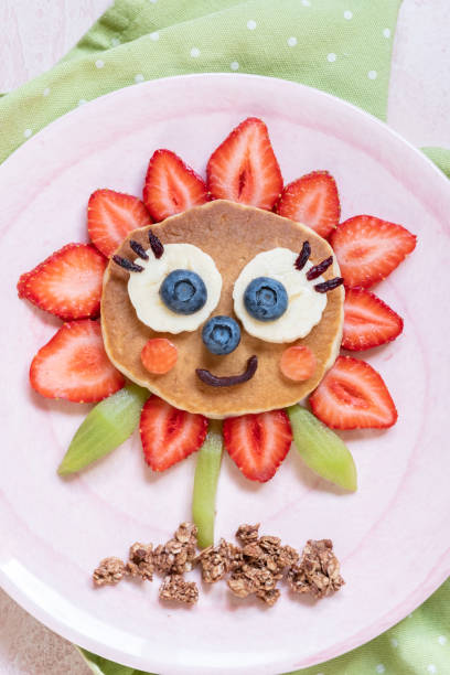 istock Funny Flower Pancake with berries for kids 1165103107
