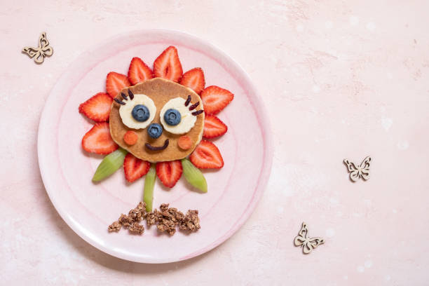 istock Funny Flower Pancake with berries for kids 1165103115