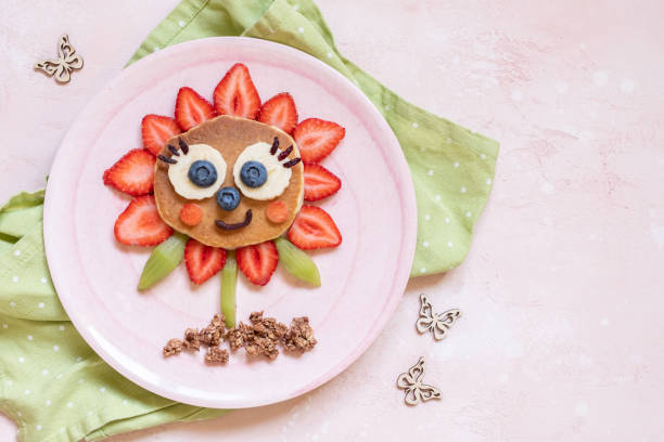 istock Funny Flower Pancake with berries for kids 1165103138