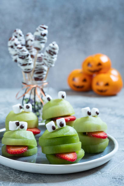istock Spooky green kiwi monsters for Halloween 1165103985