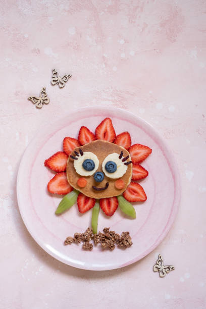 istock Funny Flower Pancake with berries for kids 1165104798
