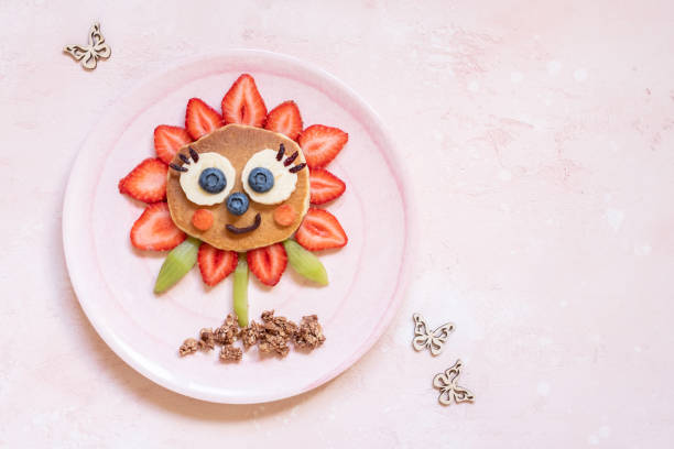 istock Funny Flower Pancake with berries for kids 1165104829