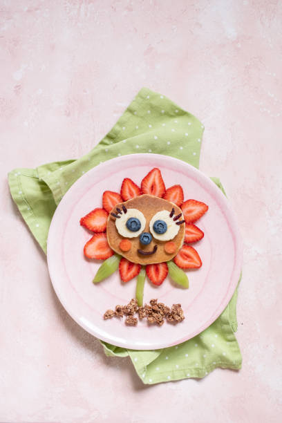 istock Funny Flower Pancake with berries for kids 1165104836