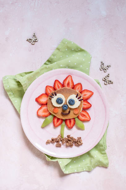 istock Funny Flower Pancake with berries for kids 1165104875