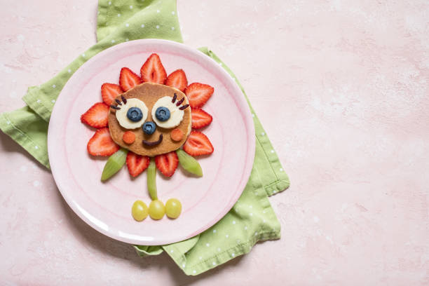 istock Funny Flower Pancake with berries for kids 1165104911