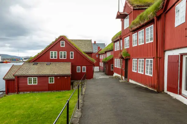 Photo of Old town of capital city of Torshavn. Typical houses with peat roof ( grass roof ). Faroes Islands. Denmark. Europe.