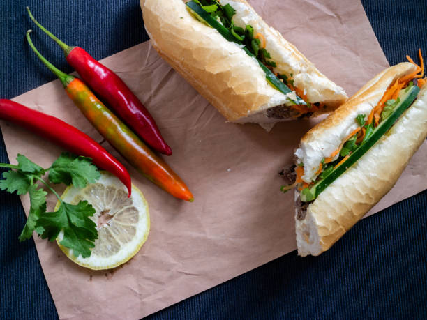 istock Sandwich from Vietnam cut and served with lemon and peppers 1165106984