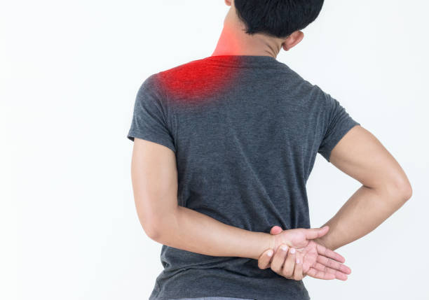 istock Young man feeling exhausted and suffering from shoulder pain, Health concept. 1165110896