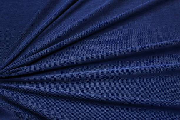 istock Cotton knit fabric in dark blue in a beautiful layout. Texture, background, pattern. 1165112542